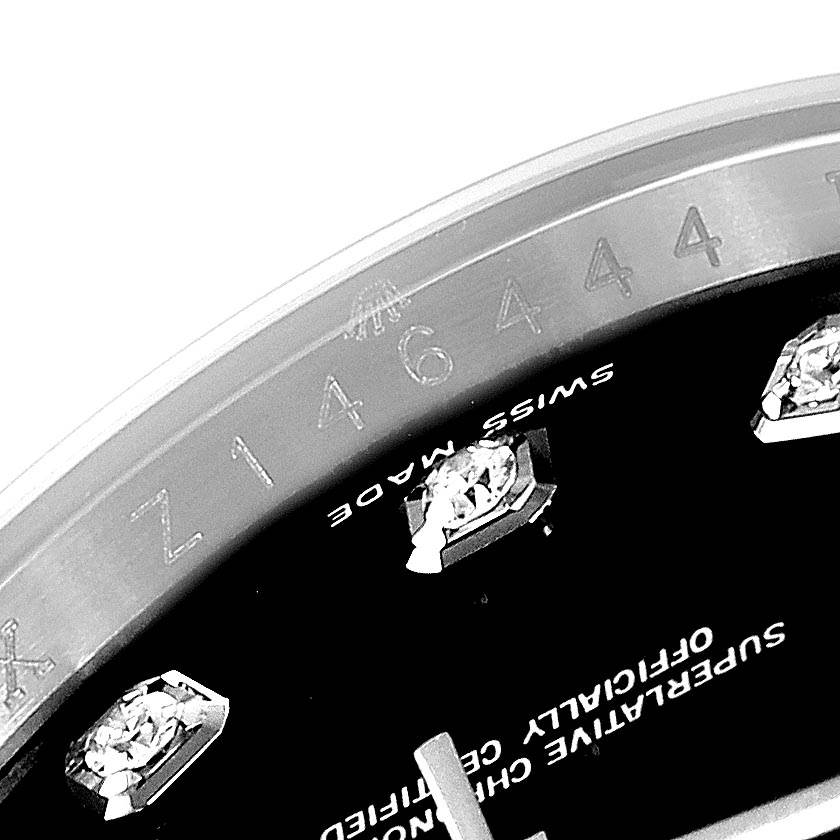 The image shows a close-up angle of the Rolex Datejust 116234 Men's Stainless Steel Black Dial 116234 Men's Stainless Steel Black Dial watch, featuring part of the dial, diamond markers, and inner bezel with serial number.