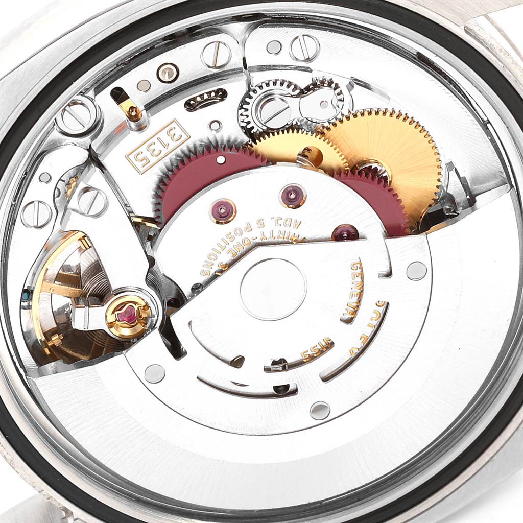 This image shows the intricate internal mechanism parts of a Rolex Datejust 116234 Men's Stainless Steel Black Dial 116234 Men's Stainless Steel Black Dial watch from a close-up, top-down angle.