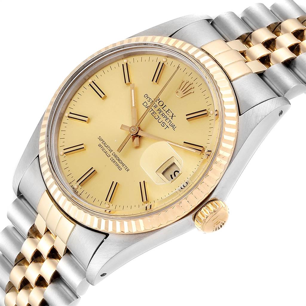 The Rolex Datejust 16013 Men
s Steel and Gold (two tone) Champagne Dial 16013 Men
s Steel and Gold (two tone) Champagne Dial watch is shown at a tilted angle, revealing the dial, bezel, crown, and part of the bracelet.