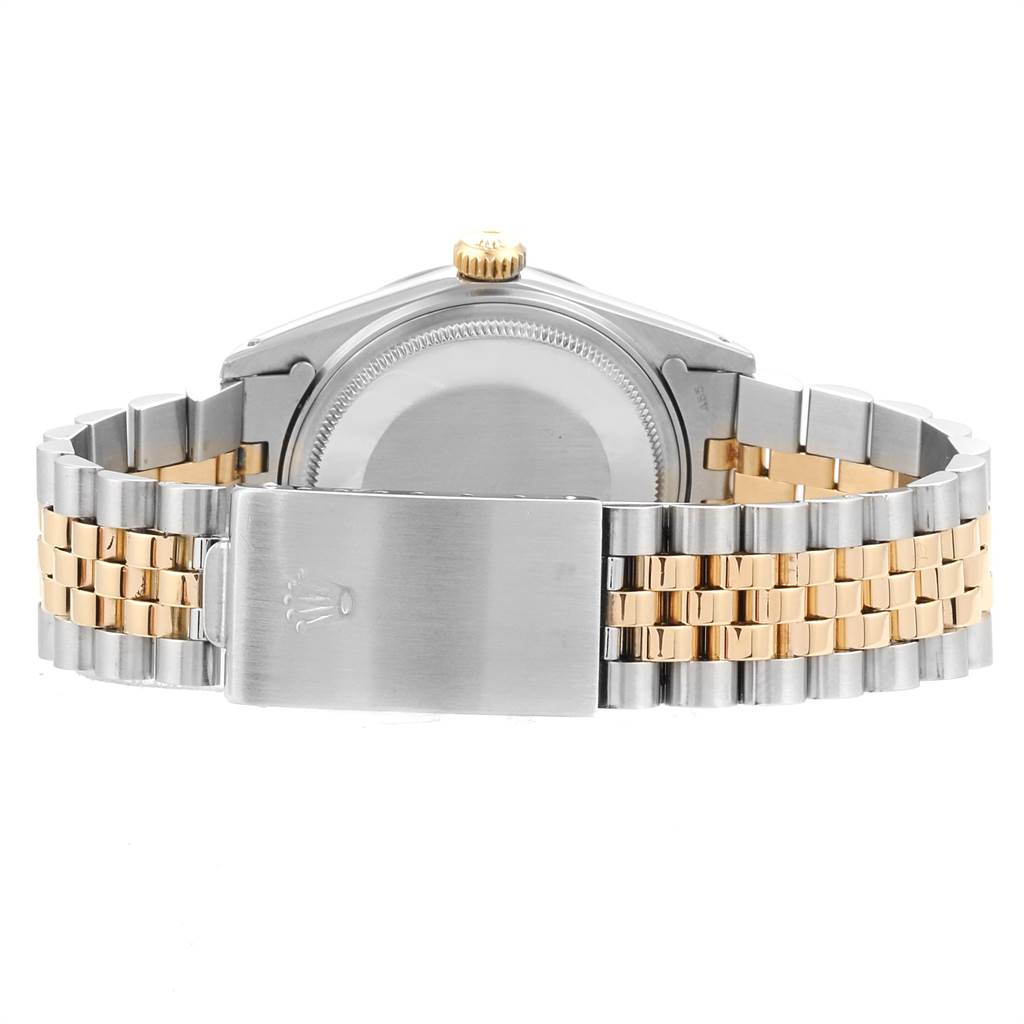 This image shows the back and bracelet of a Rolex Datejust 16013 Men
s Steel and Gold (two tone) Champagne Dial 16013 Men
s Steel and Gold (two tone) Champagne Dial watch, highlighting the clasp and two-tone metal design.