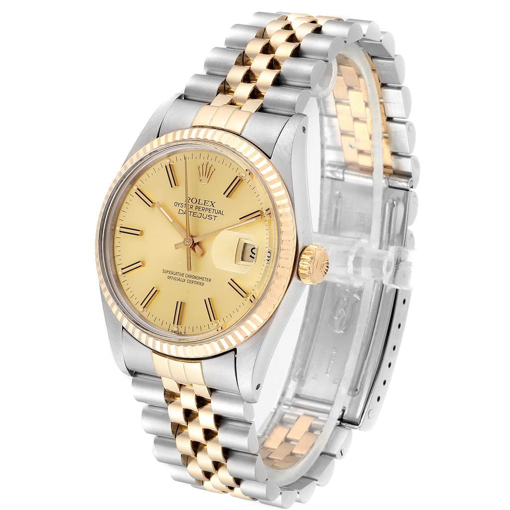 This image shows a Rolex Datejust 16013 Men
s Steel and Gold (two tone) Champagne Dial 16013 Men
s Steel and Gold (two tone) Champagne Dial watch from the front angle, highlighting its gold and silver bracelet, dial, and fluted bezel.