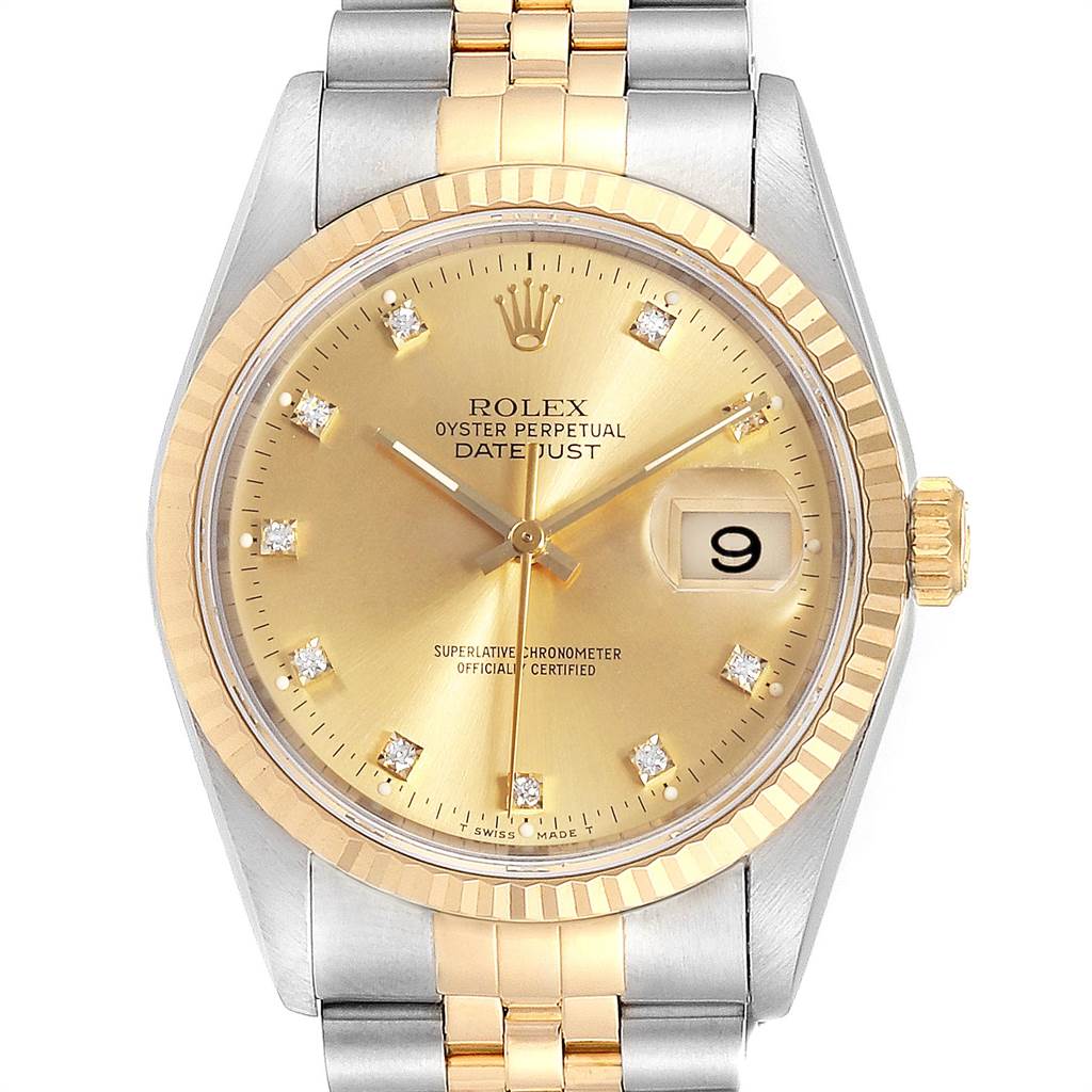 This is a front view of a Rolex Datejust 16233 Men
s Steel and Gold (two tone) Champagne Dial 16233 Men
s Steel and Gold (two tone) Champagne Dial watch, showcasing its gold dial, date window, and two-tone bracelet.
