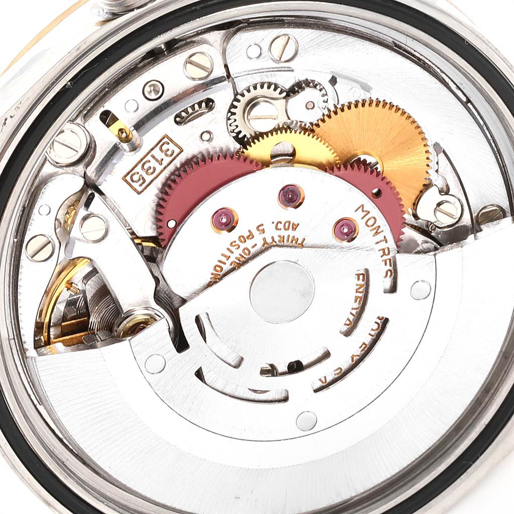 This image shows the movement mechanism of a Rolex Datejust 16233 Men
s Steel and Gold (two tone) Champagne Dial 16233 Men
s Steel and Gold (two tone) Champagne Dial watch, highlighting gears and components.