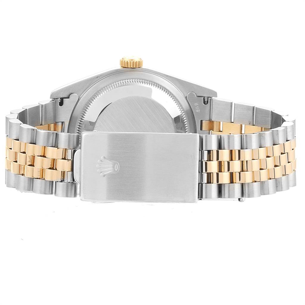 The image shows the back view of a Rolex Datejust 16233 Men
s Steel and Gold (two tone) Champagne Dial 16233 Men
s Steel and Gold (two tone) Champagne Dial watch, highlighting its case back, crown, and two-tone bracelet with clasp.