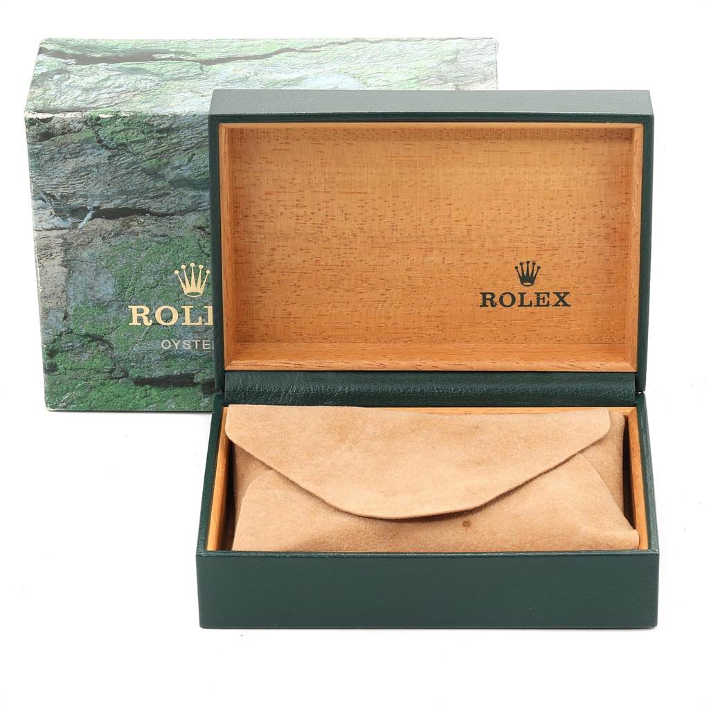 The image shows an open Rolex Datejust 16233 Men
s Steel and Gold (two tone) Champagne Dial 16233 Men
s Steel and Gold (two tone) Champagne Dial watch box with a suede pouch inside.