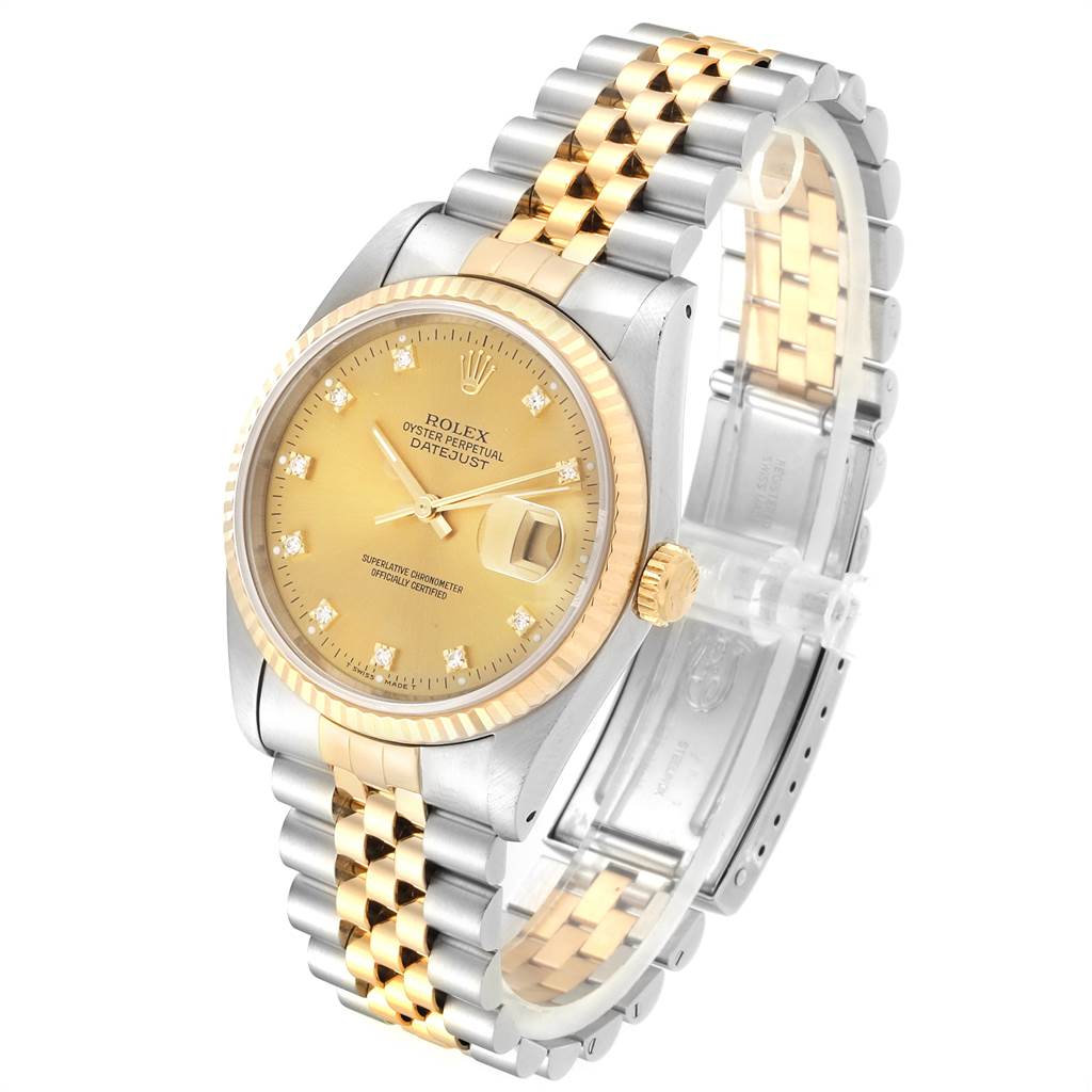 This image shows a Rolex Datejust 16233 Men
s Steel and Gold (two tone) Champagne Dial 16233 Men
s Steel and Gold (two tone) Champagne Dial watch at a three-quarter angle, highlighting its gold and stainless steel bracelet, gold dial, and fluted bezel.