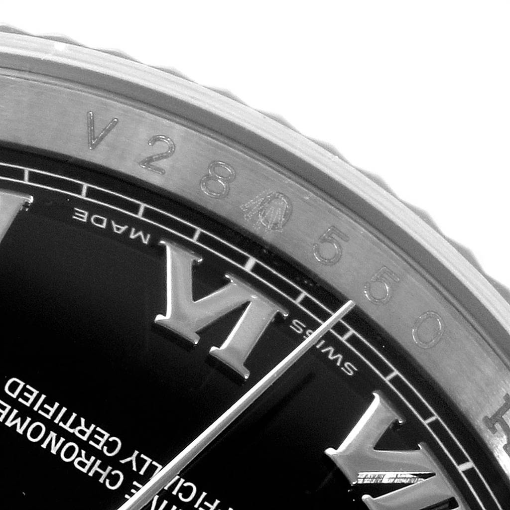Close-up of the bezel and part of the dial and hands of a Rolex Datejust 116234 Men's Stainless Steel Black Dial 116234 Men's Stainless Steel Black Dial watch, displaying the 'Swiss Made' text and hour markers.