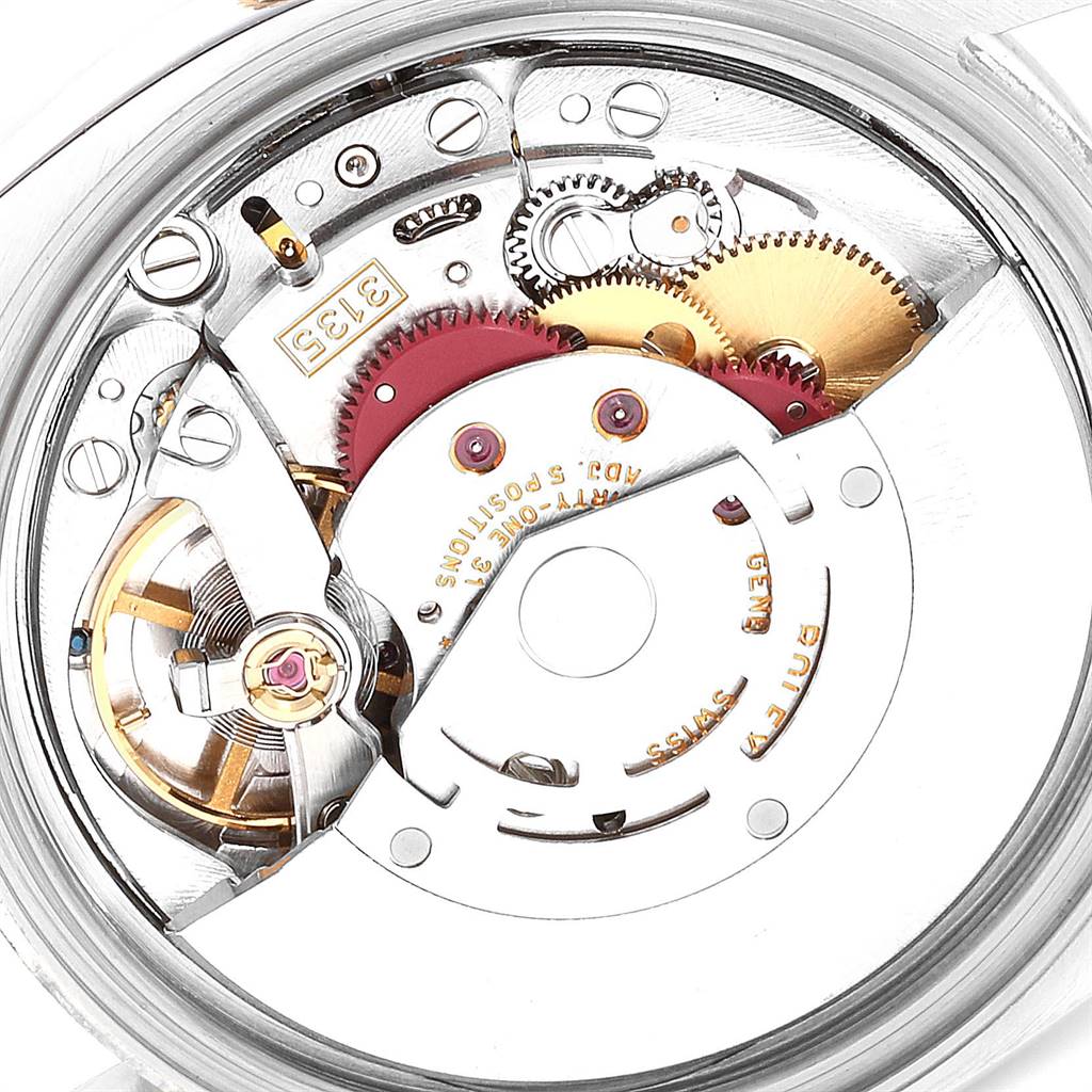 This image shows a close-up view of the intricate inner mechanical parts of a Rolex Datejust 116233 Men's Stainless Steel White Dial 116233 Men's Stainless Steel White Dial watch.