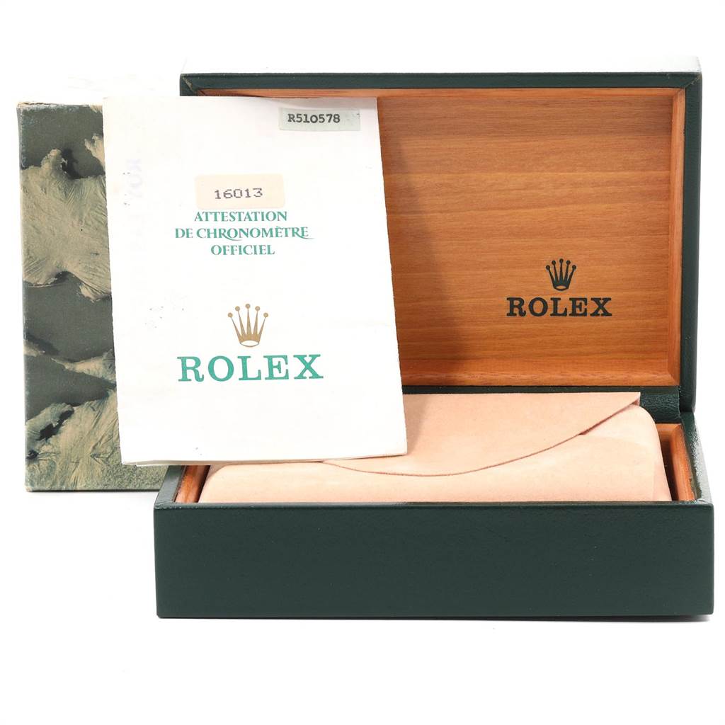 This image shows a Rolex Datejust 16013 Men's Stainless Steel Champagne Dial 16013 Men's Stainless Steel Champagne Dial watch box, an official certification paper, and a cushioned insert.