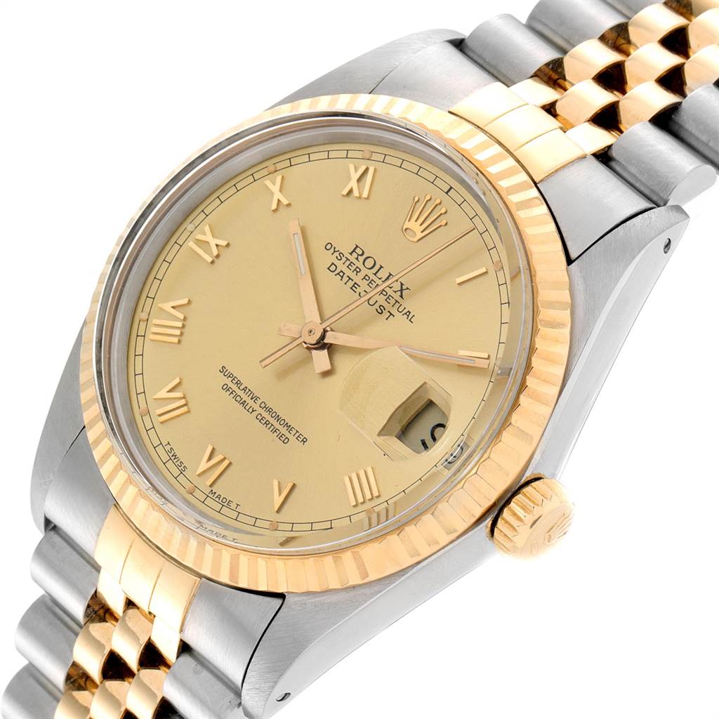 This image shows a Rolex Datejust 16013 Men's Stainless Steel Champagne Dial 16013 Men's Stainless Steel Champagne Dial watch from a slightly angled view, highlighting its gold Roman numeral dial, fluted bezel, and two-tone bracelet.