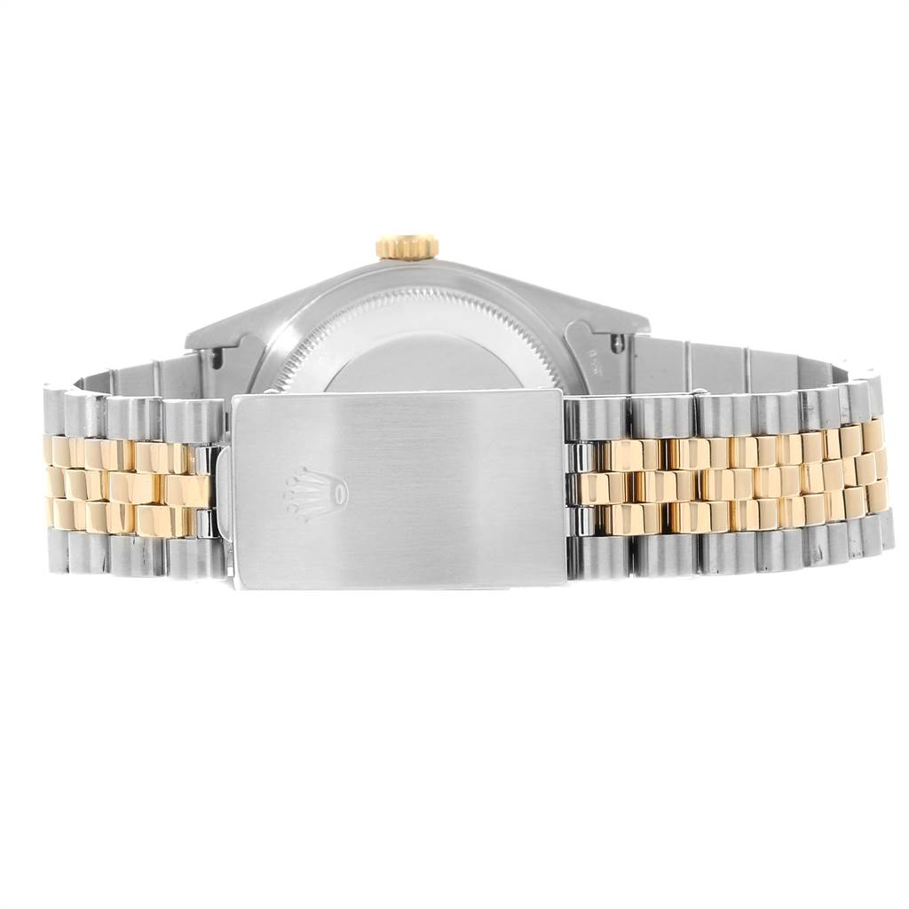 This image shows the back view of a Rolex Datejust 16233 Men
s Steel and Gold (two tone) Champagne Dial 16233 Men
s Steel and Gold (two tone) Champagne Dial watch, highlighting its two-tone bracelet and clasp.