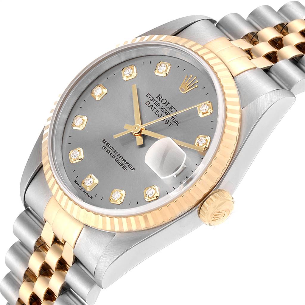 The image shows a Rolex Datejust 16233 Men's Steel and Gold (two tone) Silver Dial 16233 Men's Steel and Gold (two tone) Silver Dial watch at an angle highlighting its face, bezel, crown, and part of the bracelet.