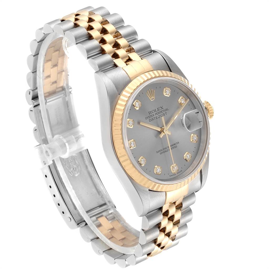 The image shows a side angle of a Rolex Datejust 16233 Men's Steel and Gold (two tone) Silver Dial 16233 Men's Steel and Gold (two tone) Silver Dial watch featuring a two-tone bracelet and a diamond-studded dial.