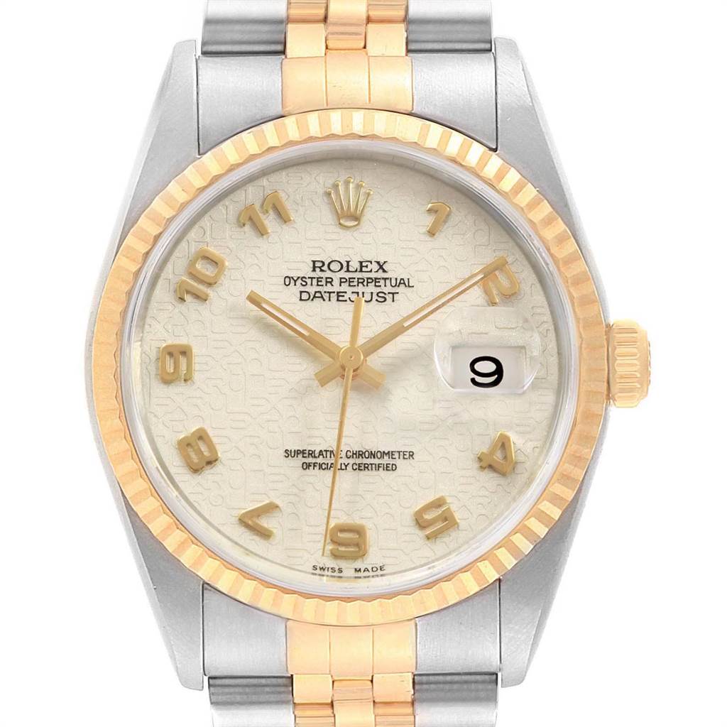 This is a close-up, front-facing view of the dial and part of the bracelet of a Rolex Datejust 16233 Men
s Steel and Gold (two tone) Beige Dial 16233 Men
s Steel and Gold (two tone) Beige Dial watch.