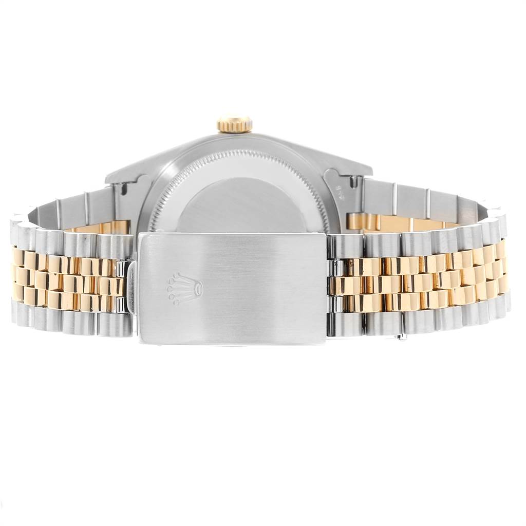 The image shows the back of a Rolex Datejust 16233 Men
s Steel and Gold (two tone) Beige Dial 16233 Men
s Steel and Gold (two tone) Beige Dial watch, focusing on the bracelet and the clasp.