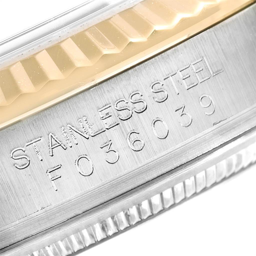 This image shows the side view of the bezel and serial number engraving on the case of a Rolex Datejust 116233 Men's Stainless Steel Mother of Pearl Dial 116233 Men's Stainless Steel Mother of Pearl Dial watch.