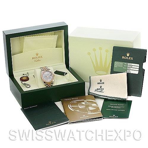 This image displays a Rolex Datejust 116231 Men's Stainless Steel Silver Dial 116231 Men's Stainless Steel Silver Dial watch in its box, accompanied by various manuals, tags, and cleaning cloths.