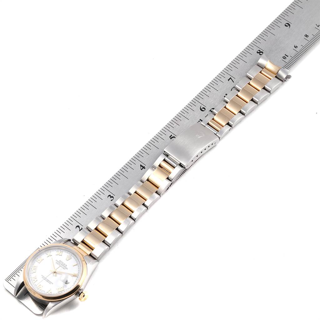 The image shows a Rolex Datejust 16203 Men's Steel and Gold (two tone) White Dial 16203 Men's Steel and Gold (two tone) White Dial watch laid flat with a ruler, highlighting the two-tone bracelet and deployment clasp.