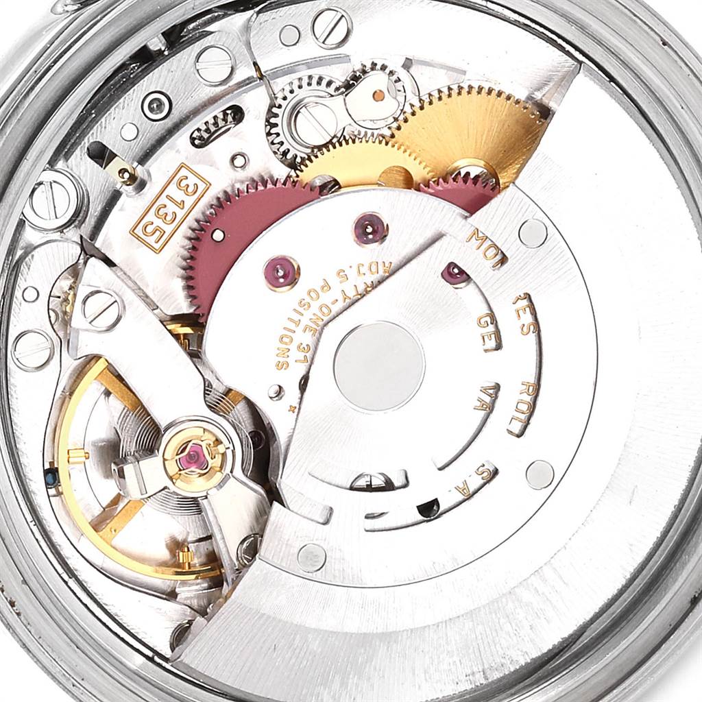 This image shows a close-up view of the movement and inner workings of a Rolex Datejust 16203 Men's Steel and Gold (two tone) White Dial 16203 Men's Steel and Gold (two tone) White Dial watch.
