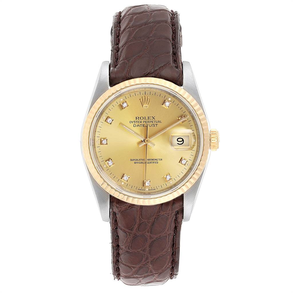 The image shows a Rolex Datejust 16233 Men
s Steel and Gold (two tone) Champagne Dial 16233 Men
s Steel and Gold (two tone) Champagne Dial watch from the front, featuring a gold dial, gold bezel, date display, and a brown leather strap.
