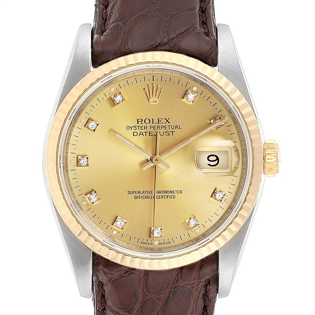 This image shows a frontal view of the Rolex Datejust 16233 Men
s Steel and Gold (two tone) Champagne Dial 16233 Men
s Steel and Gold (two tone) Champagne Dial watch, highlighting its gold dial, bezel, and dark brown leather strap.