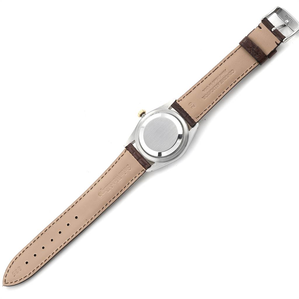 The image shows the back of a Rolex Datejust 16233 Men
s Steel and Gold (two tone) Champagne Dial 16233 Men
s Steel and Gold (two tone) Champagne Dial watch, depicting the case back and leather straps.