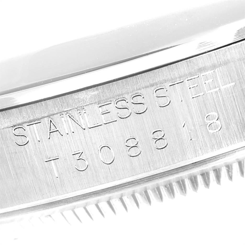 The image shows a close-up of the Rolex Datejust 16200 Men's Stainless Steel White Dial 16200 Men's Stainless Steel White Dial model's stainless steel case with the serial number engraved.