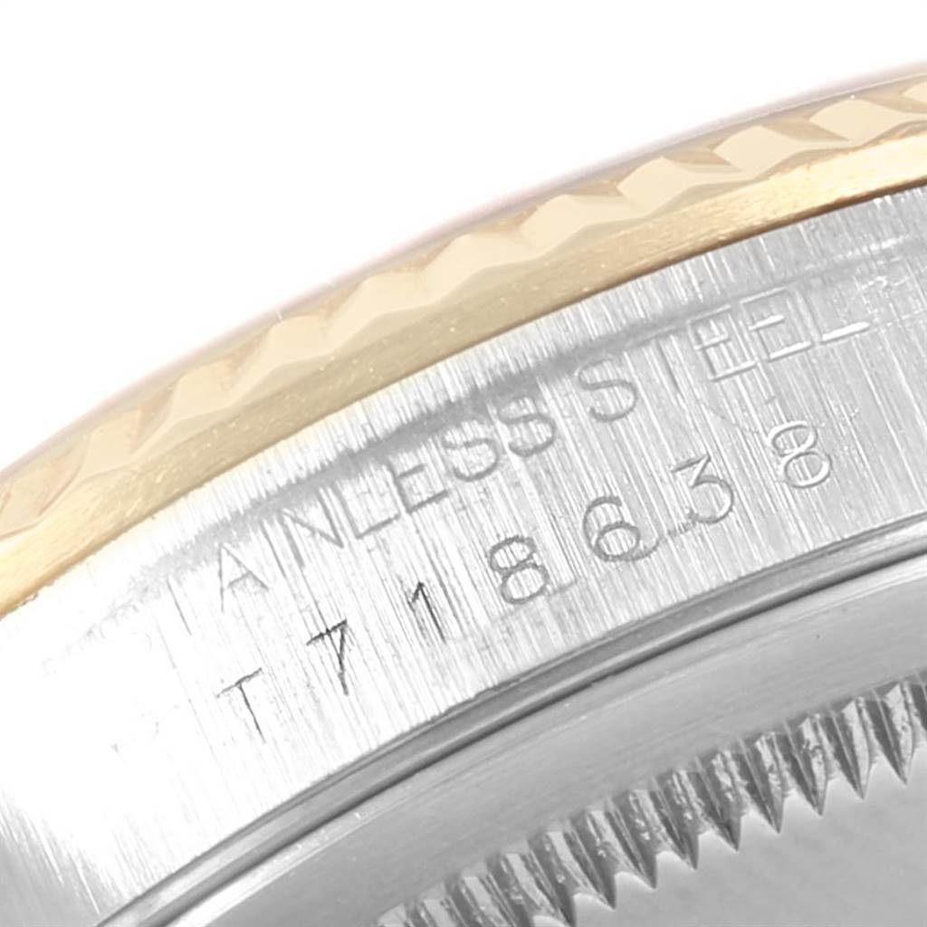 This close-up image shows the stainless steel case back and fluted bezel edge of a Rolex Datejust 16233 Men's Steel and Gold (two tone) Champagne Dial 16233 Men's Steel and Gold (two tone) Champagne Dial watch.