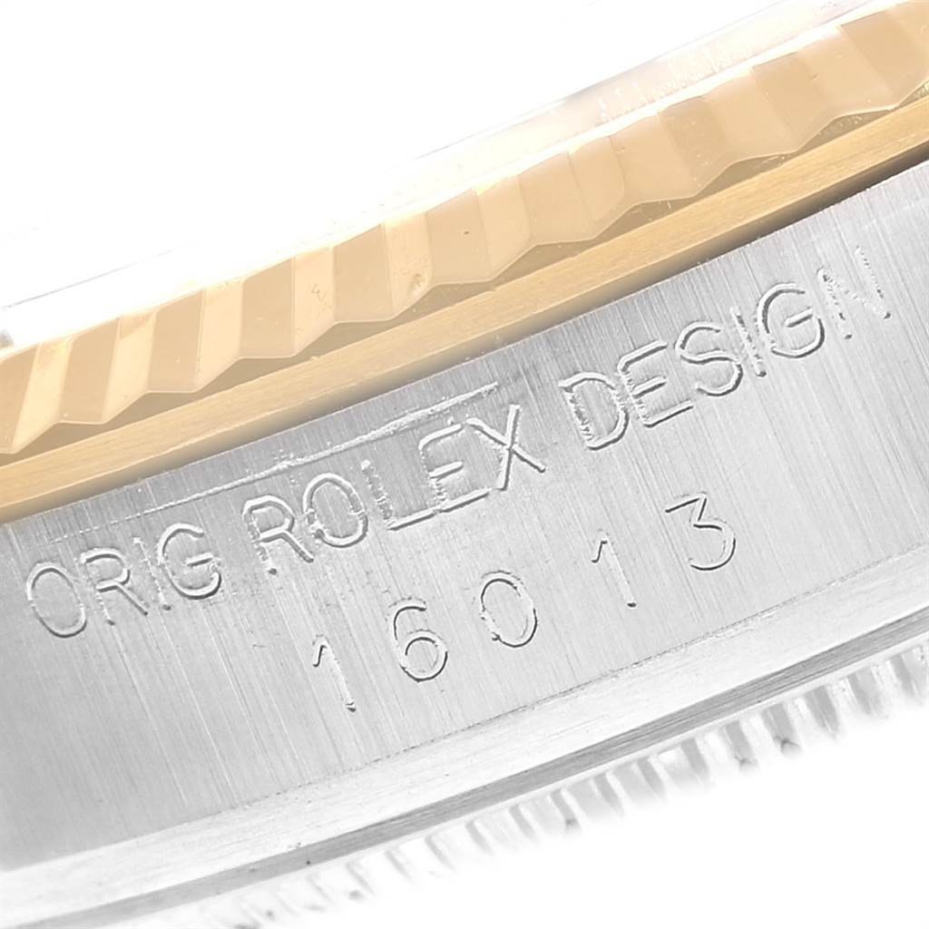 This image shows a close-up angle of the case side of a Rolex Datejust 16013 Men's Stainless Steel Black Dial 16013 Men's Stainless Steel Black Dial watch, highlighting the engraved model number 16013 and "ORIG ROLEX DESIGN."