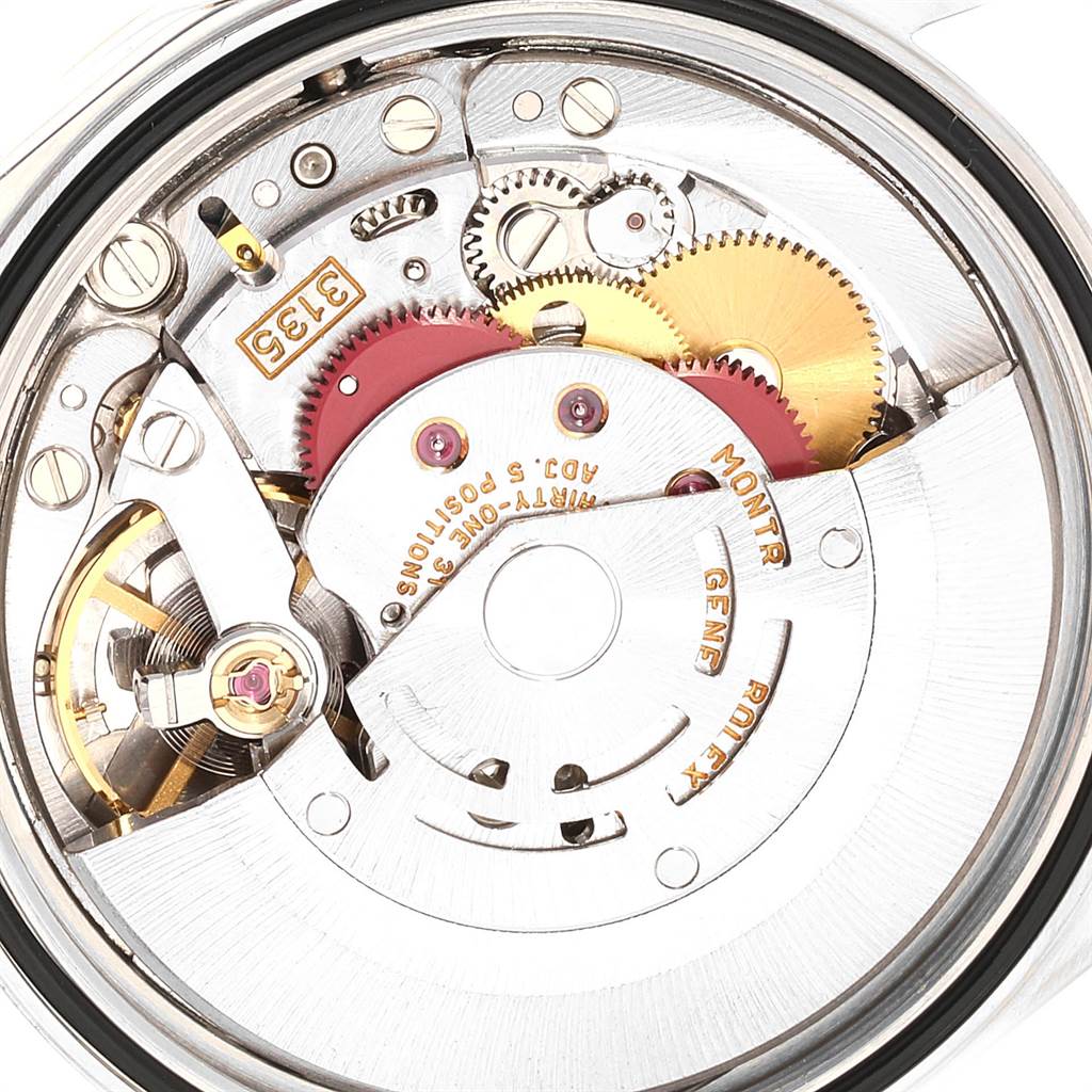 The image shows a close-up view of the mechanical movement inside a Rolex Datejust 16233 Men's Steel and Gold (two tone) Champagne Dial 16233 Men's Steel and Gold (two tone) Champagne Dial watch, highlighting gears and components.