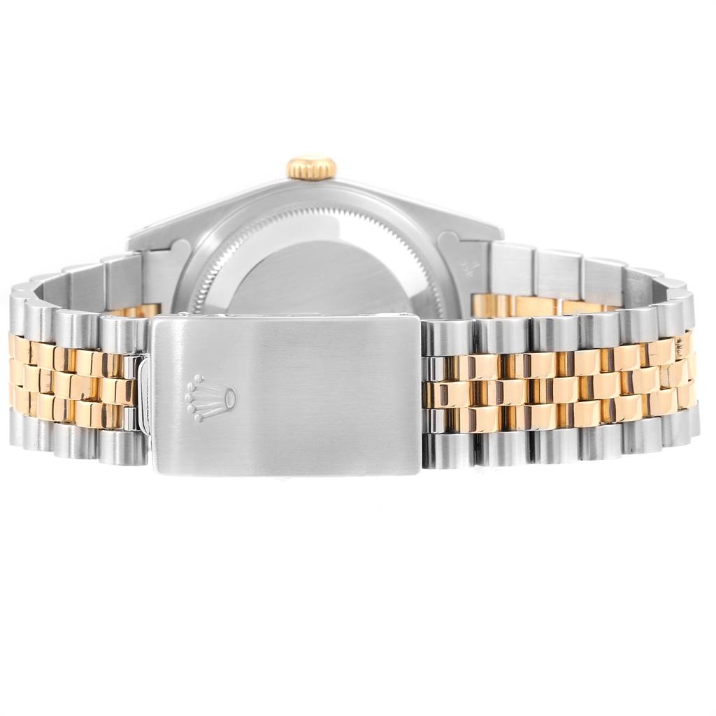 The image shows the back view of a Rolex Datejust 16233 Men
s Steel and Gold (two tone) Beige Dial 16233 Men
s Steel and Gold (two tone) Beige Dial watch, focusing on the clasp and bracelet.
