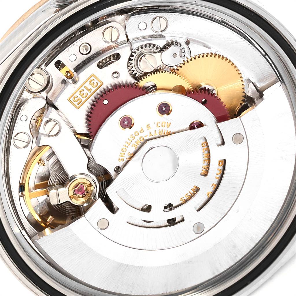 The image shows the intricate movement and internal mechanisms of a Rolex Datejust 16233 Men
s Steel and Gold (two tone) Champagne Dial 16233 Men
s Steel and Gold (two tone) Champagne Dial watch.