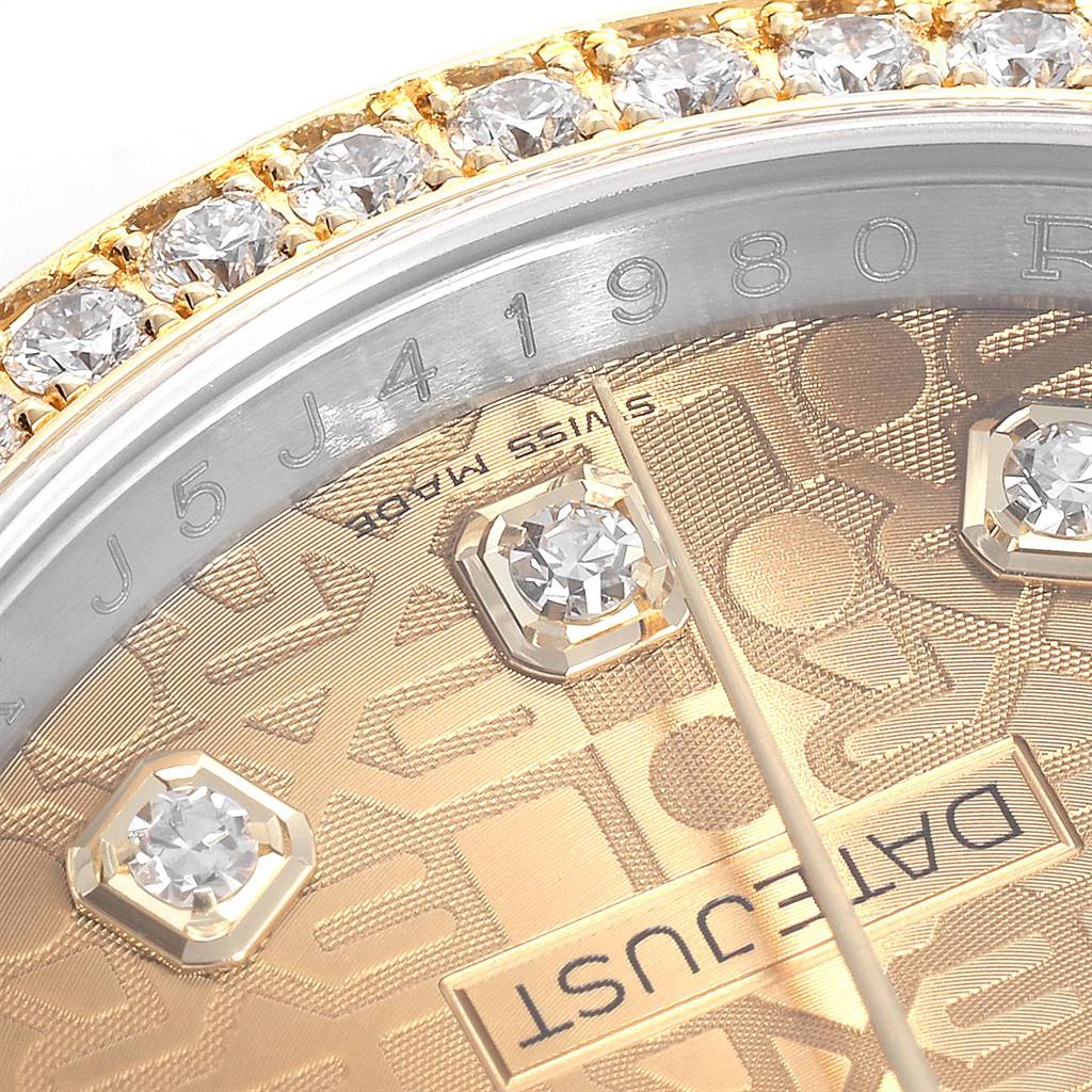 Close-up of the Rolex Datejust 116243 Men's Steel and Gold (two tone) Champagne Dial 116243 Men's Steel and Gold (two tone) Champagne Dial watch showing the dial, diamond markers, and part of the serial number and bezel.