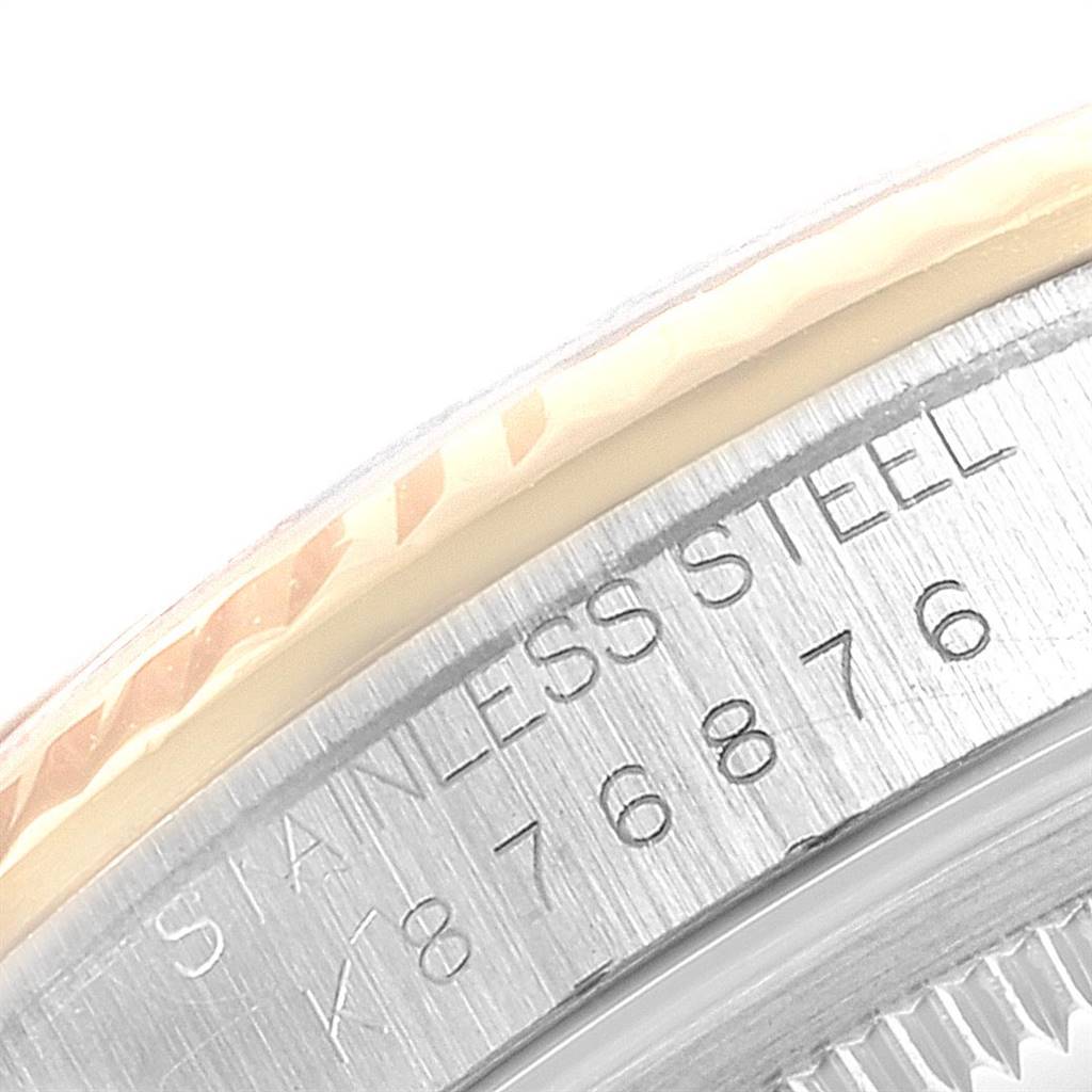 This image is a close-up of the casing back of a Rolex Datejust 16233 Men
s Steel and Gold (two tone) Black Dial 16233 Men
s Steel and Gold (two tone) Black Dial watch, showing part of the stainless steel bezel and inscription.