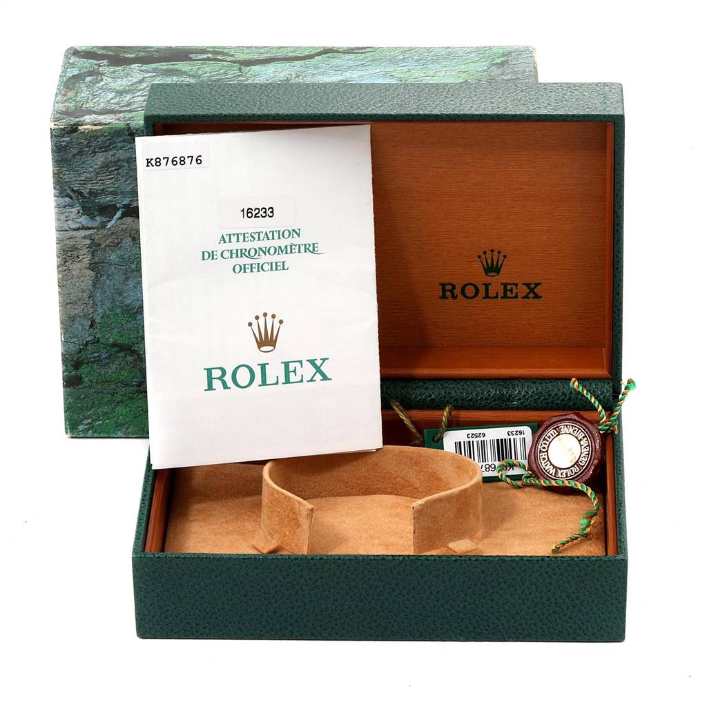 The image shows the open box, documentation, and accessories for a Datejust model by Rolex.