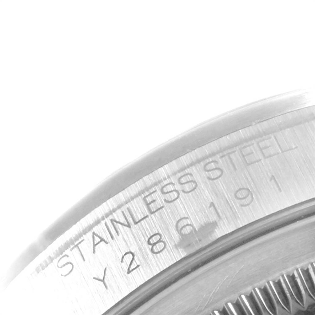 This is a close-up image of the serial number and rim of a Rolex Datejust 16200 Men's Stainless Steel White Dial 16200 Men's Stainless Steel White Dial stainless steel watch.