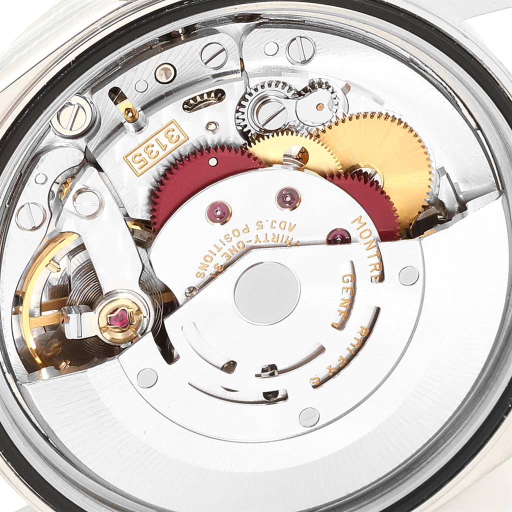 The image shows a close-up of the mechanical movement inside a Rolex Datejust 16200 Men's Stainless Steel White Dial 16200 Men's Stainless Steel White Dial watch, revealing its gears and components.