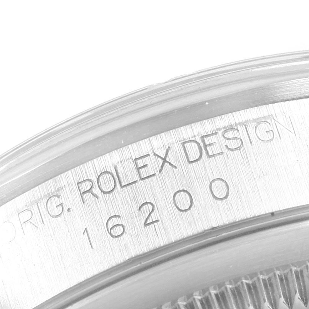 The image shows a close-up of the case back of a Rolex Datejust 16200 Men's Stainless Steel White Dial 16200 Men's Stainless Steel White Dial model, displaying the watch's serial and design numbers.