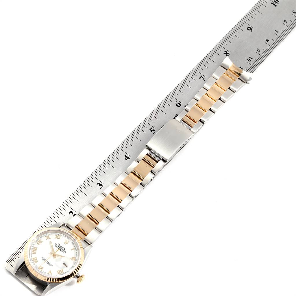 The image shows a Rolex Datejust 16233 Men's Steel and Gold (two tone) White Dial 16233 Men's Steel and Gold (two tone) White Dial watch, laid flat alongside a ruler, displaying its face and full bracelet.