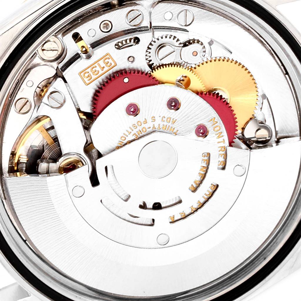 This image shows the intricate internal mechanism of a Rolex Datejust 16233 Men's Steel and Gold (two tone) White Dial 16233 Men's Steel and Gold (two tone) White Dial watch, featuring gears and precision components.