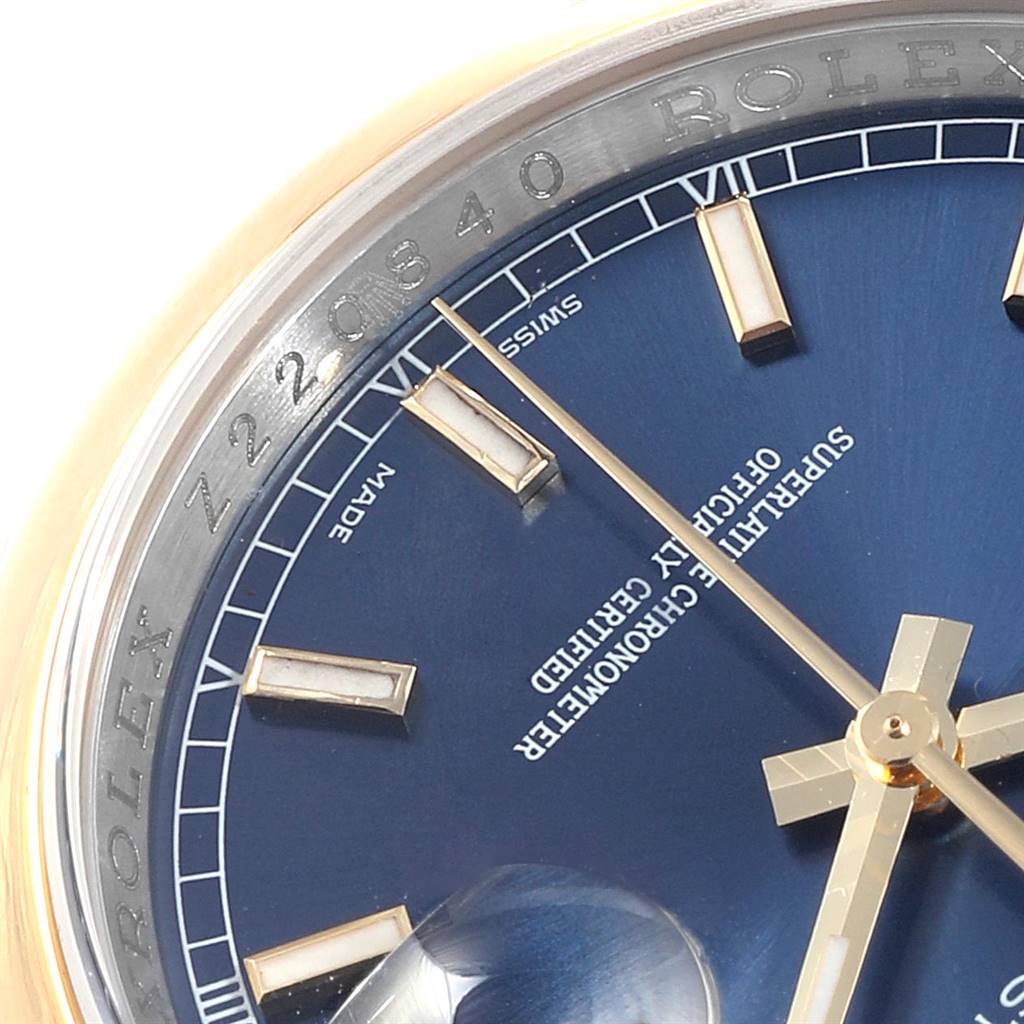 The image shows a close-up of the dial and serial number engraving on the bezel of a Rolex Datejust 116203 Men
s Steel and Gold (two tone) Blue Dial 116203 Men
s Steel and Gold (two tone) Blue Dial watch.