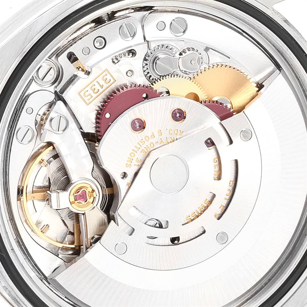 The image shows a close-up of the movement and inner mechanical parts of a Rolex Datejust 116203 Men
s Steel and Gold (two tone) Blue Dial 116203 Men
s Steel and Gold (two tone) Blue Dial watch.