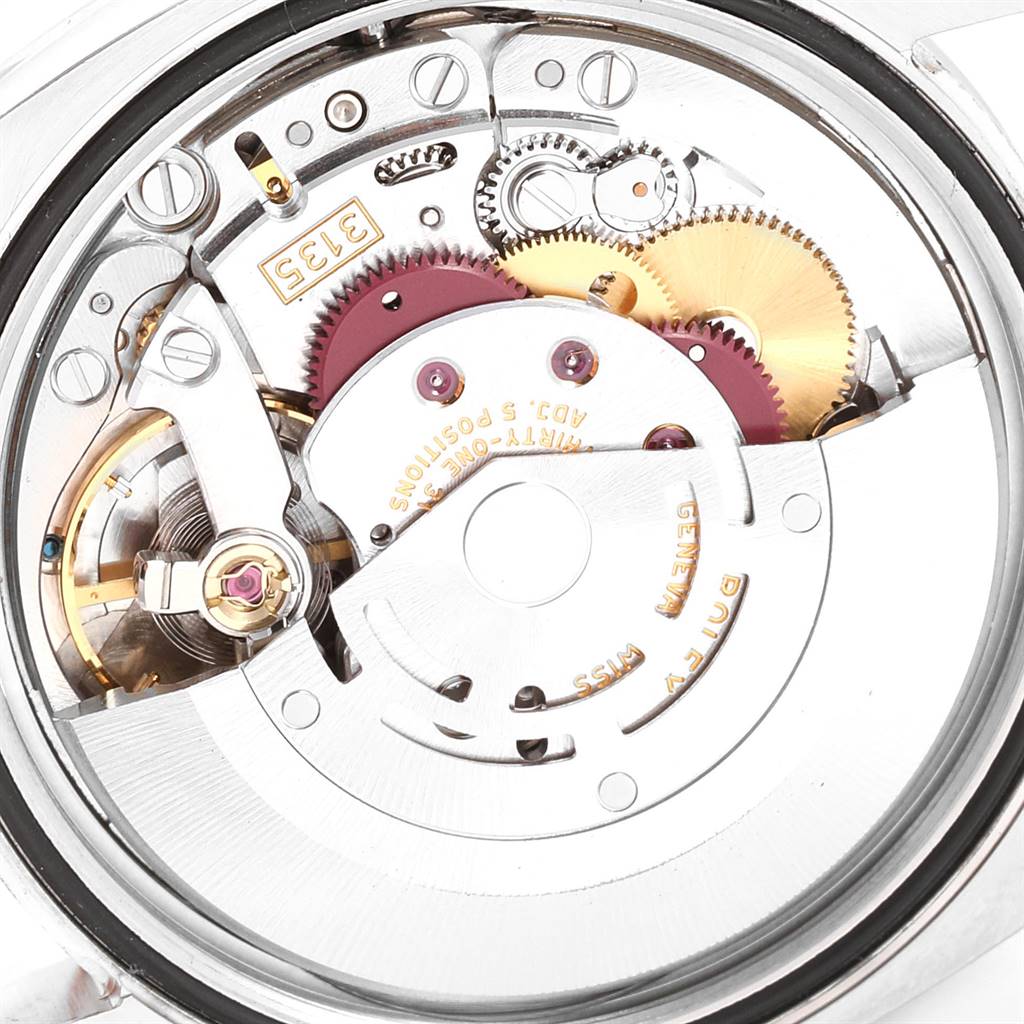 The image shows the intricate inner mechanics of the Rolex Datejust 116233 Men
s Stainless Steel Blue Dial 116233 Men
s Stainless Steel Blue Dial model viewed from the back case, including gears and the rotor.