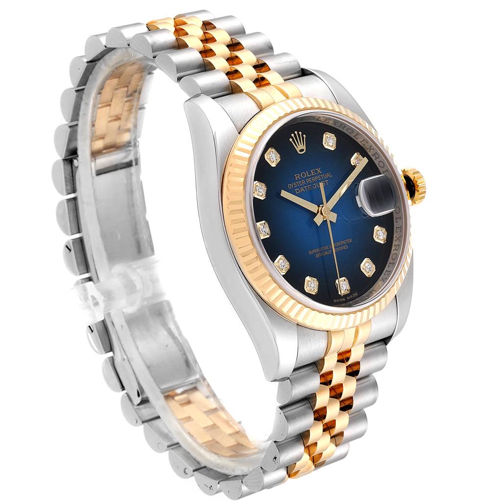The image shows a side-angle view of a Rolex Datejust 116233 Men
s Stainless Steel Blue Dial 116233 Men
s Stainless Steel Blue Dial watch, highlighting its blue dial, fluted bezel, and two-tone bracelet.
