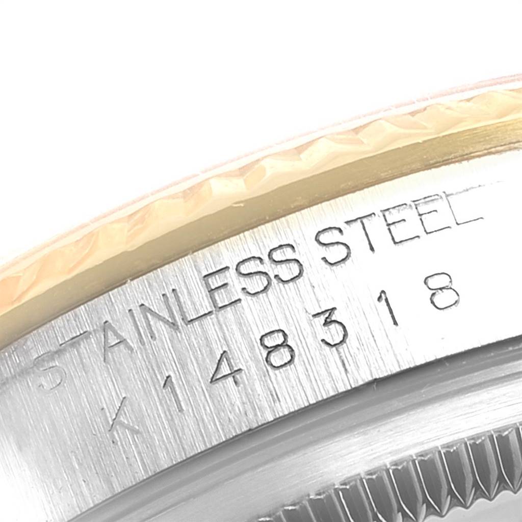 This image shows a close-up of the engraved caseback of a Rolex Datejust 16233 Men's Steel and Gold (two tone) Silver Dial 16233 Men's Steel and Gold (two tone) Silver Dial watch.