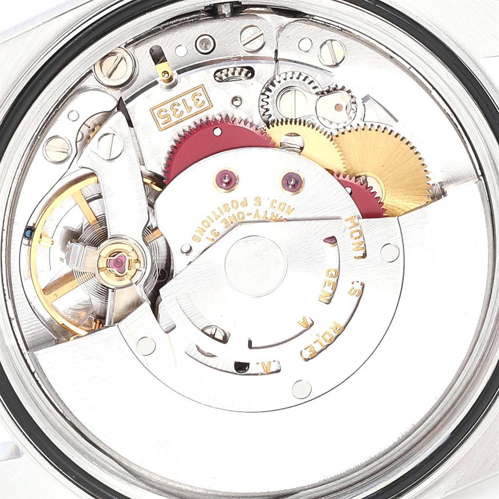 This image shows the internal mechanism of a Rolex Datejust 16233 Men's Steel and Gold (two tone) Silver Dial 16233 Men's Steel and Gold (two tone) Silver Dial model from a rear angle, highlighting the gears and movement components.