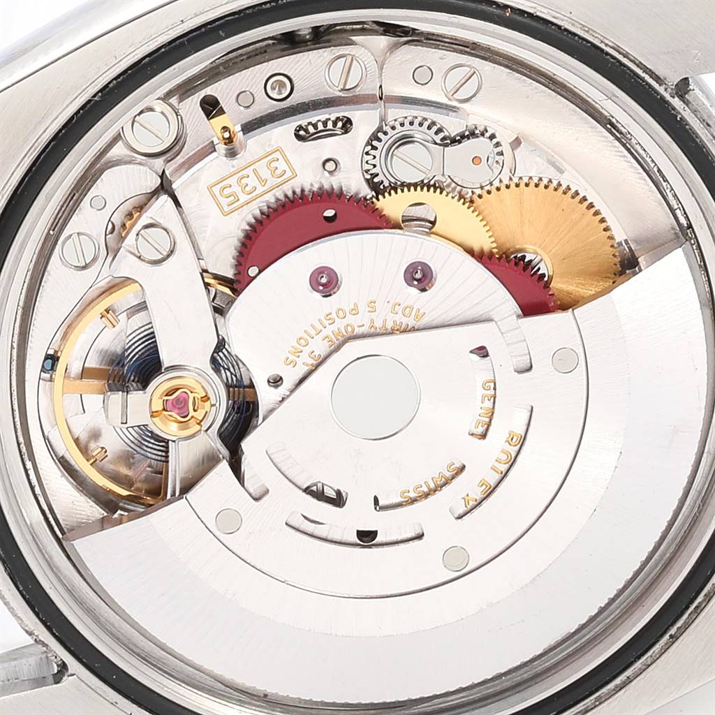 This image shows a close-up of the movement and internal components of a Rolex Datejust 116200 Men
s Stainless Steel Blue Dial 116200 Men
s Stainless Steel Blue Dial watch.