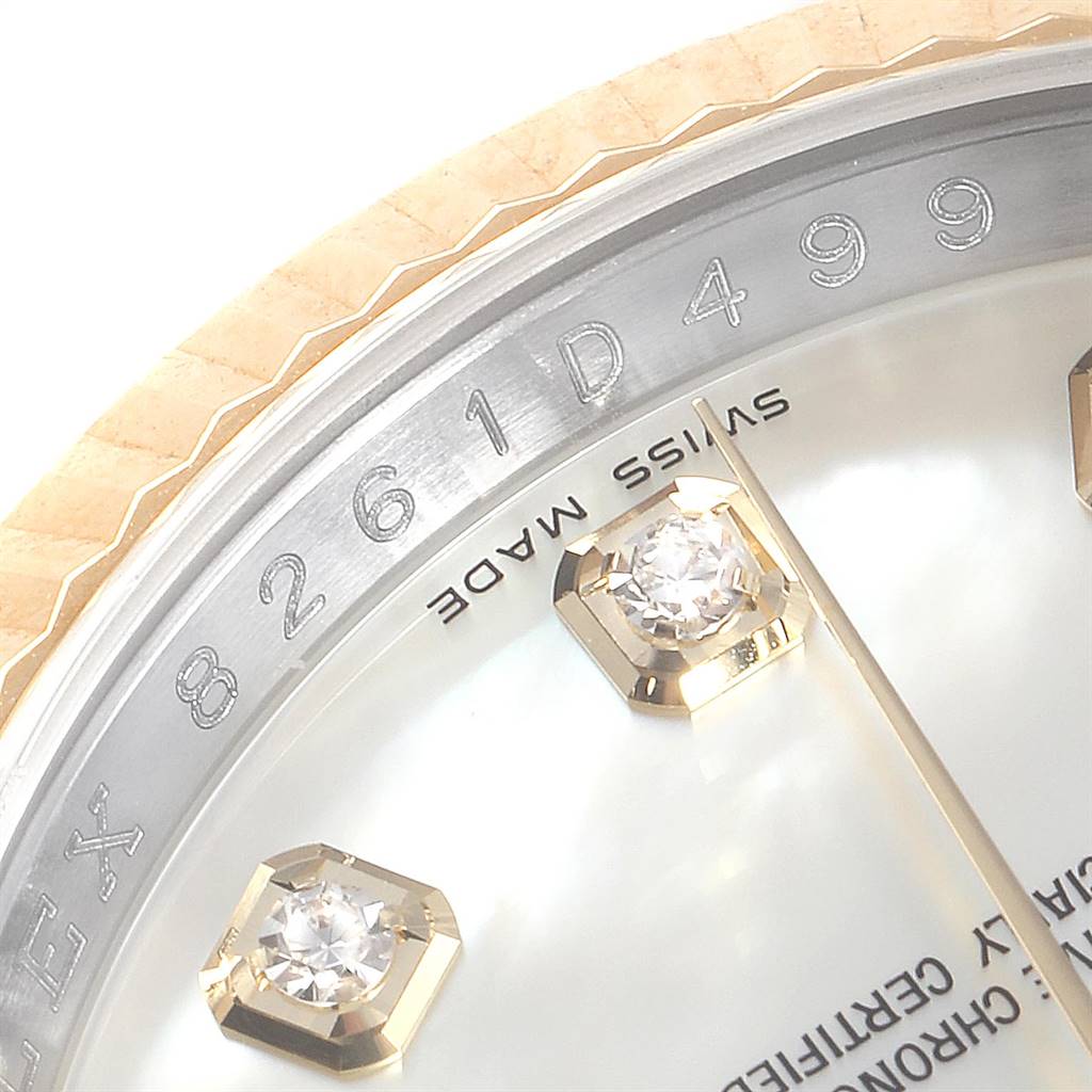 Close-up view of the Rolex Datejust 116233 Men
s Stainless Steel Mother of Pearl Dial 116233 Men
s Stainless Steel Mother of Pearl Dial watch, focusing on the dial, diamond markers, and part of the rehaut with engravings.