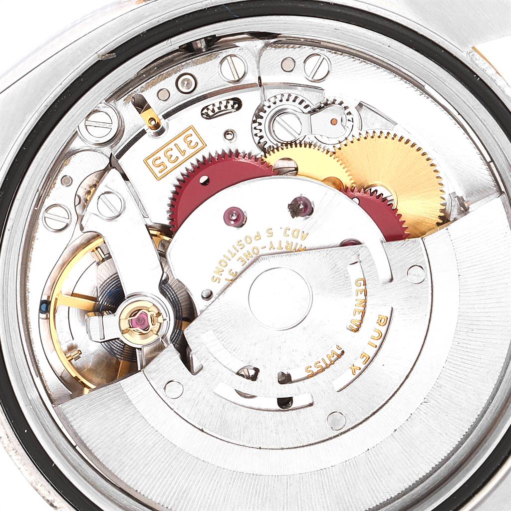 This image shows the movement of a Rolex Datejust 116233 Men
s Stainless Steel Mother of Pearl Dial 116233 Men
s Stainless Steel Mother of Pearl Dial watch, revealing gears and mechanical components from the back.