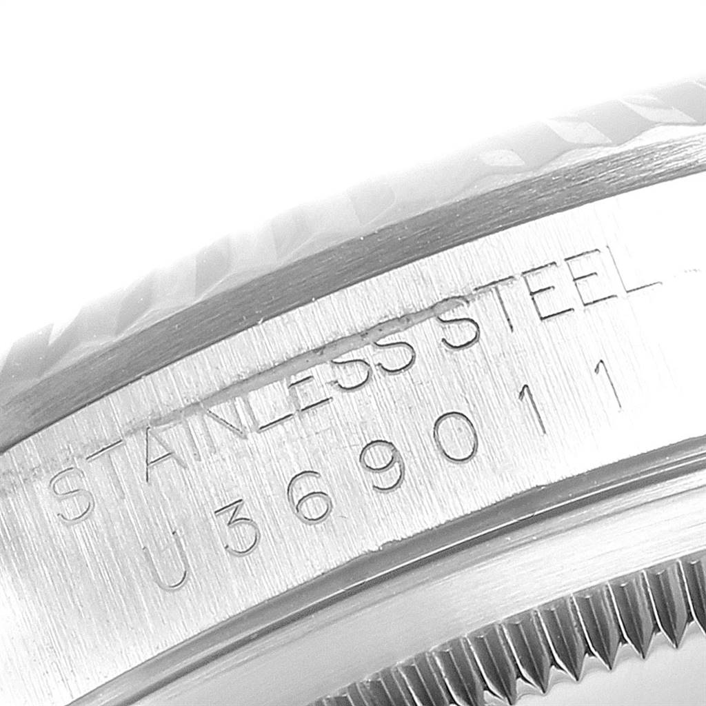 This close-up image shows the side engraving of a stainless steel Rolex Datejust 16234 Men's Stainless Steel Silver Dial 16234 Men's Stainless Steel Silver Dial watch model.